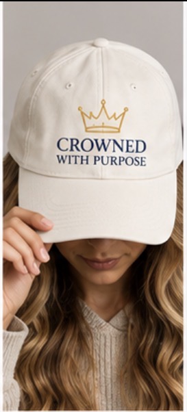 Model wearing the cream Crowned With Purpose embroidered cap