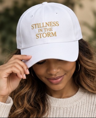 White Stillness in the Storm embroidered cap with gold serif lettering
