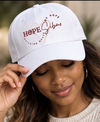 White Hopesibuo cap with HOPE heart logo and Building Nests of Hope embroidery